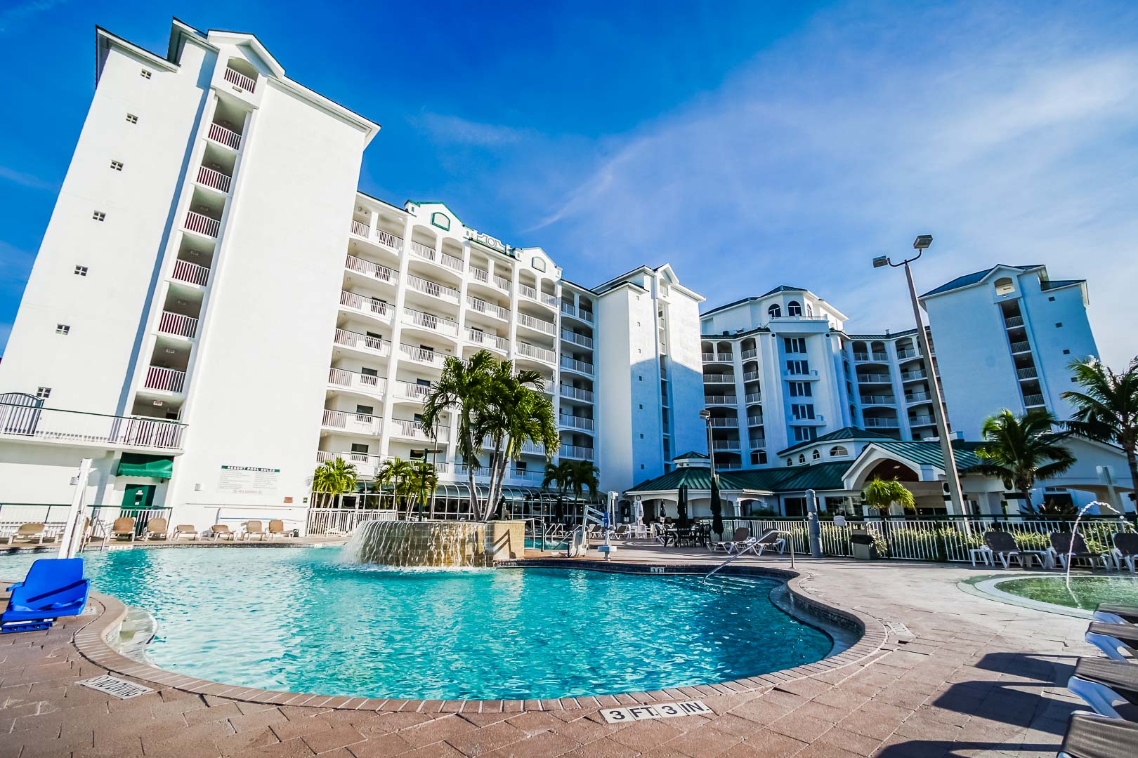 A stoic resort view with a pool at VRI's The Resort on Cocoa Beach in Florida.